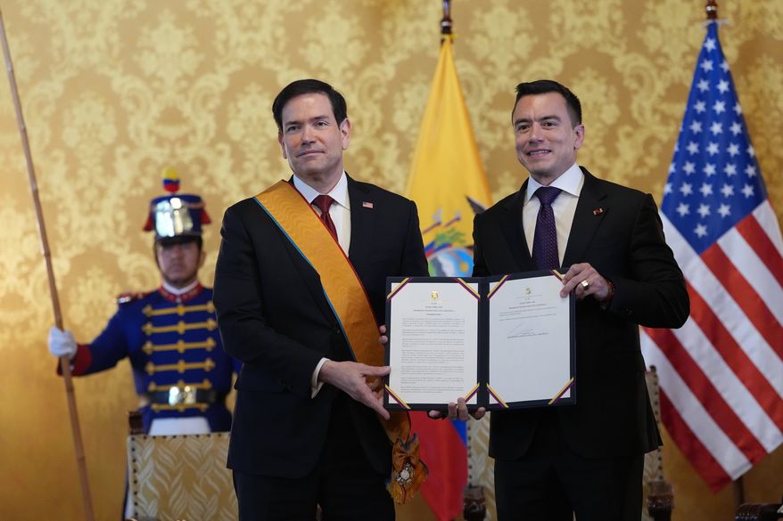 Ecuador's President Daniel Noboa, right, and U.S. Sec. of State Marco Rubio hold a document related to Ecuador's highest-ranking National Order of Merit, the Grand Cross, presented to Rubio, which he is wearing, at Carondelet palace in Quito, Ecuador, Wednesday, Sept. 9, 2026. (AP Photo/Dolores Ochoa, Pool)