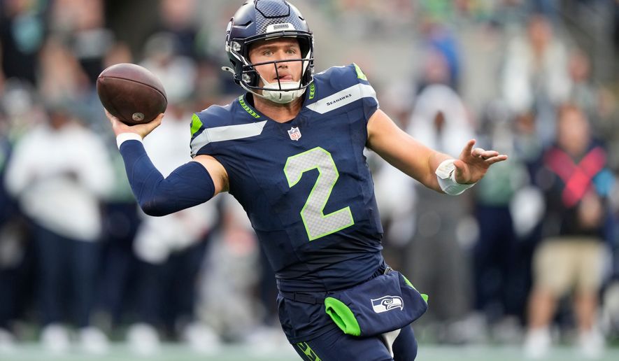 Seattle Seahawks quarterback Drew Lock throws a pass during the first half of an NFL football game against the New England Patriots, Wednesday, Sept. 9, 2026, in Seattle. (AP Photo/Stephen Brashear)