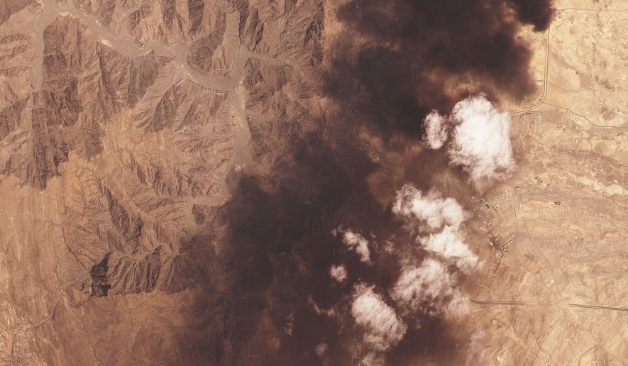 This image provided by Planet Labs PBC shows a plume of black smoke rising from a Saudi Aramco oil refinery, on top, north of Abha, Saudi Arabia Tuesday, Sept. 8, 2026. (Planet Labs PBC via AP)
