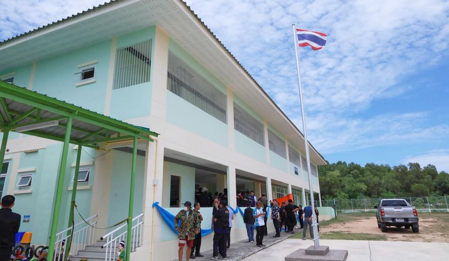 In this photo released by the Chonburi government's Public Relations Department, police officers gather inside Nongplalai Municipal Kindergarten after a gunman fatally shot a teacher in Chonburi, Thailand, Wednesday, Sept. 9, 2026. (Chonburi Government Public Relations Department via AP)