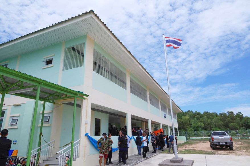 In this photo released by the Chonburi government's Public Relations Department, police officers gather inside Nongplalai Municipal Kindergarten after a gunman fatally shot a teacher in Chonburi, Thailand, Wednesday, Sept. 9, 2026. (Chonburi Government Public Relations Department via AP)