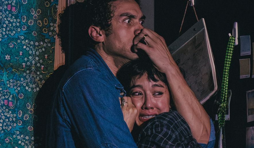 Travis A. Knight, left, and Cher Álvarez appear during a performance of the play "Paranormal Activity" in Boston on July 10, 2026. (Matthew Murphy via AP)