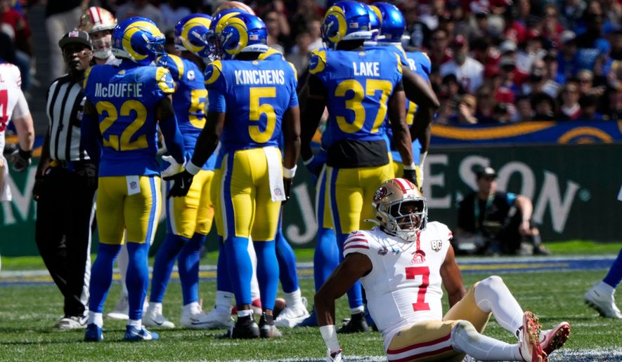 San Francisco 49ers wide receiver De'zhaun Stribling (7) sits on the field after being injured in the first half of an NFL football game against the Los Angeles Rams in Melbourne, Australia, Friday, Sept. 11, 2026. (AP Photo/Doug Benc)