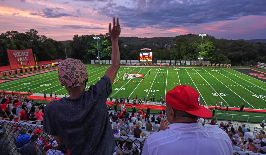 Aliquippa High School football fans cheer during a high school football game between Aliquippa and Mars high schools at Heinz Field in Aliquippa, Pa., Friday, Sept. 4, 2026. (AP Photo/Gene J. Puskar)