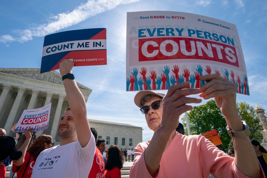 FILE - Immigration activists rally outside the Supreme Court as the justices hear arguments over the Trump administration's plan to ask about citizenship on the 2020 Census, in Washington, April 23, 2019. (AP Photo/J. Scott Applewhite, File)