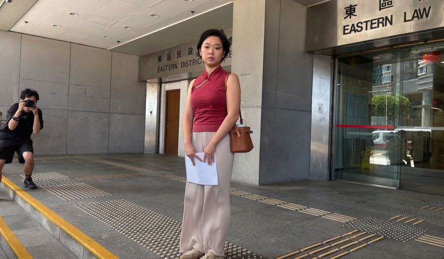 Selina Cheng, chair of the Hong Kong Journalists Association and a former reporter for The Wall Street Journal, is photographed before speaking to reporters at the Eastern Magistrates' Courts following a verdict on Thursday, Sept. 10, 2026. (AP Photo/Kanis Leung)