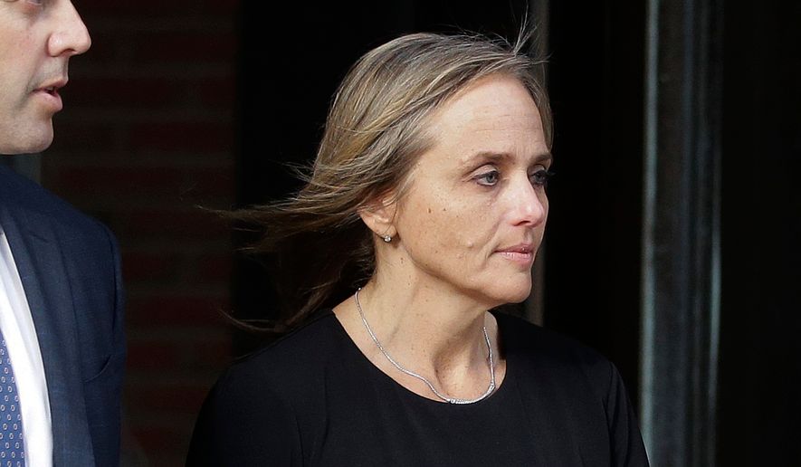 FILE - District Court Judge Shelley Joseph departs federal court, April 25, 2019, in Boston. (AP Photo/Steven Senne, File)