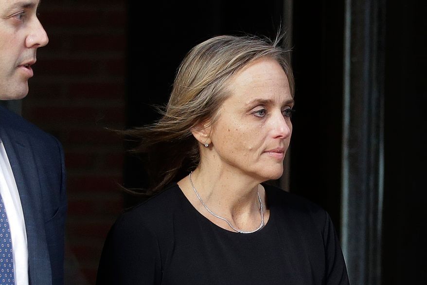 FILE - District Court Judge Shelley Joseph departs federal court, April 25, 2019, in Boston. (AP Photo/Steven Senne, File)