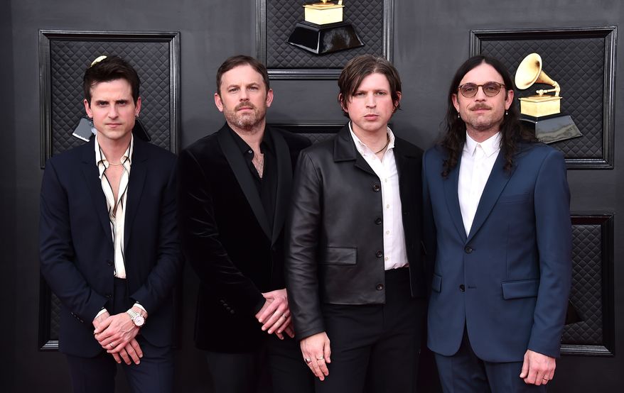 FILE - Jared Followill, from left, Caleb Followill, Matthew Followill, and Nathan Followill of Kings of Leon appear at the 64th Annual Grammy Awards in Las Vegas on April 3, 2022. (Photo by Jordan Strauss/Invision/AP, File)