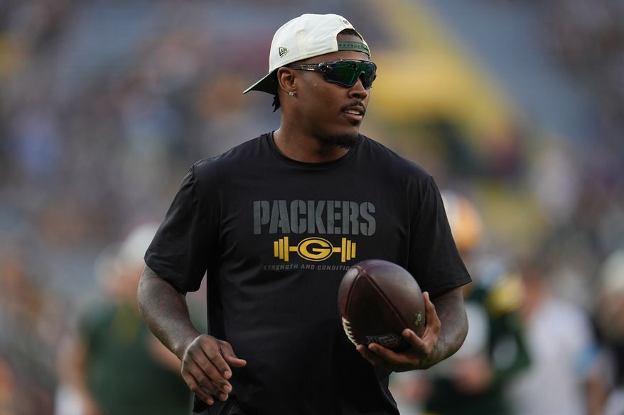 FILE - Green Bay Packers running back Josh Jacobs stands on the field before a NFL preseason football game against the Arizona Cardinals, Aug. 28, 2026, in Green Bay, Wis. (AP Photo/Abbie Parr, File)