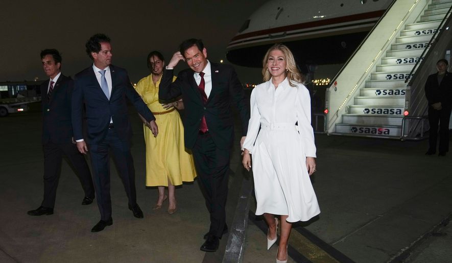 U.S. Secretary of State Marco Rubio, second right, and his wife Jeanette Rubio, right, deplane at a military base in Lima, Peru, Wednesday, Sept. 9, 2026. (AP Photo/Martin Mejia, Pool)