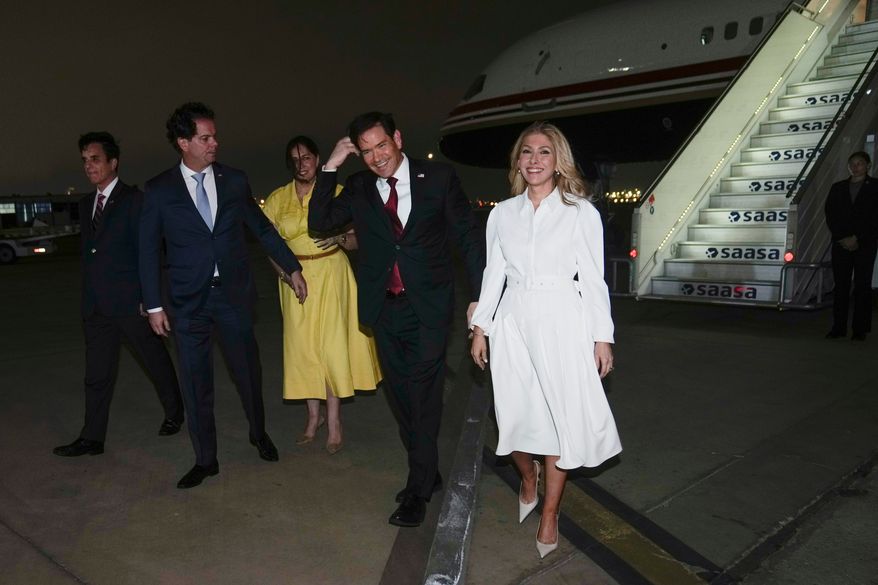 U.S. Secretary of State Marco Rubio, second right, and his wife Jeanette Rubio, right, deplane at a military base in Lima, Peru, Wednesday, Sept. 9, 2026. (AP Photo/Martin Mejia, Pool)