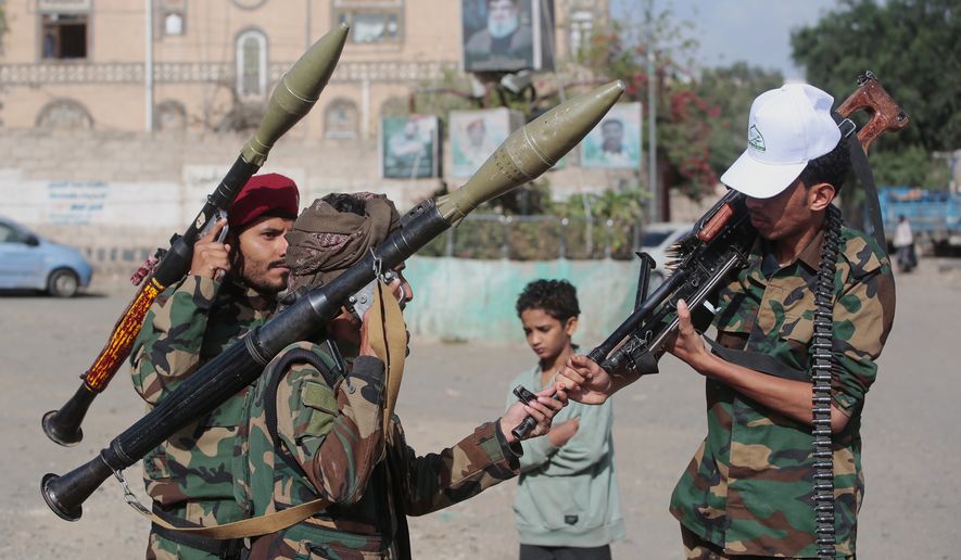 Yemen's Houthi rebels chat as they check their weapons during a mobilization campaign in Sanaa, Yemen, Thursday, Sept. 10, 2026. (AP Photo)