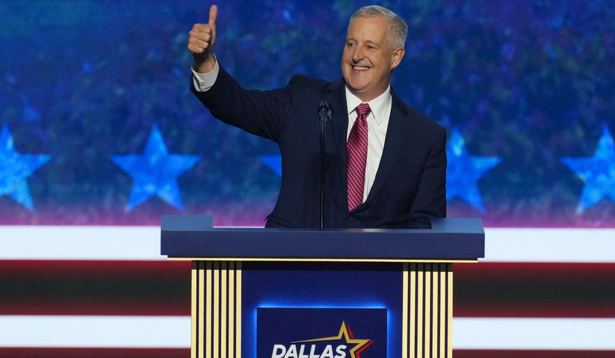 Michael Whatley, North Carolina senatorial candidate, greets delegates as he takes the stage at the Republican convention in Dallas, Wednesday, Sept. 9, 2026. (AP Photo/Tony Gutierrez)
