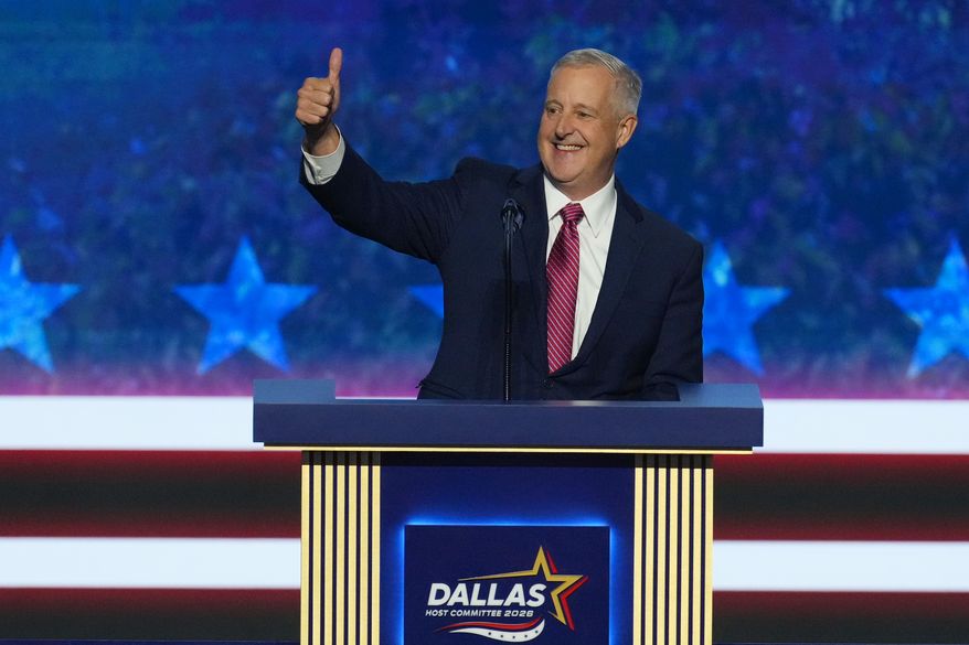 Michael Whatley, North Carolina senatorial candidate, greets delegates as he takes the stage at the Republican convention in Dallas, Wednesday, Sept. 9, 2026. (AP Photo/Tony Gutierrez)