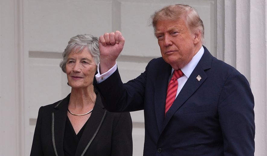 U.S. President Donald Trump gestures as he is welcomed by Ireland's President Catherine Connolly at Aras an Uachtarain in Dublin, Saturday, Sept. 12, 2026.(AP Photo/Kin Cheung)
