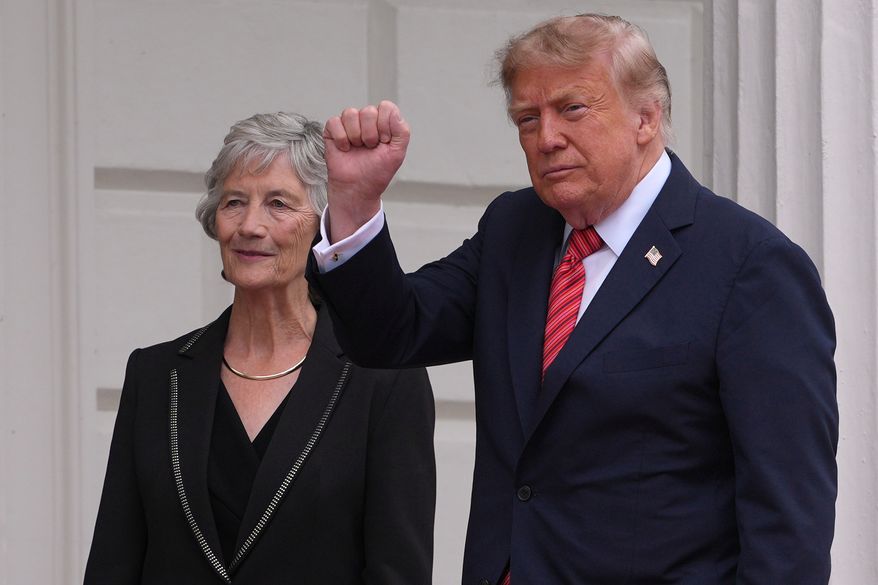 U.S. President Donald Trump gestures as he is welcomed by Ireland's President Catherine Connolly at Aras an Uachtarain in Dublin, Saturday, Sept. 12, 2026.(AP Photo/Kin Cheung)