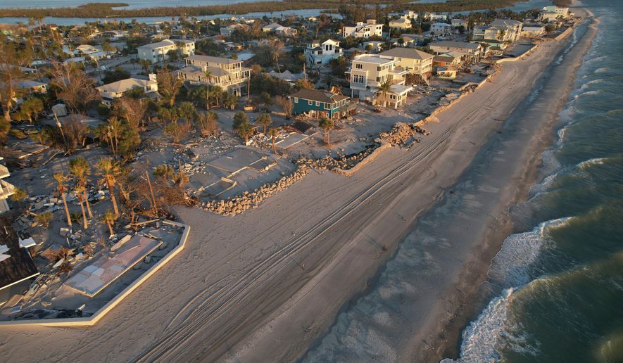 Waves roll in from the Gulf of Mexico toward lots where only empty foundations and debris remain after homes were swept away in Hurricane Milton on Manasota Key in Englewood, Fla., Oct. 13, 2024. (AP Photo/Rebecca Blackwell, File)