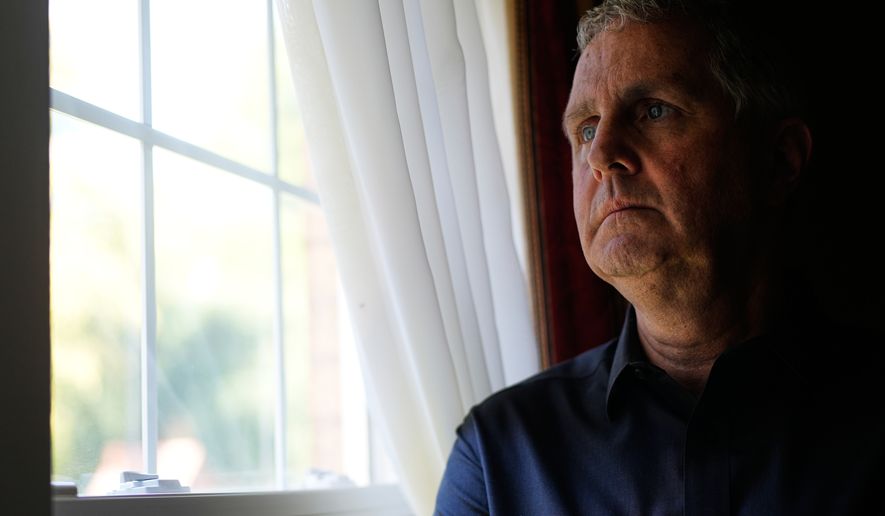 Michael Rabbitt poses for a photo at his home in Chicago, Thursday, Aug. 27, 2026. (AP Photo/Nam Y. Huh)