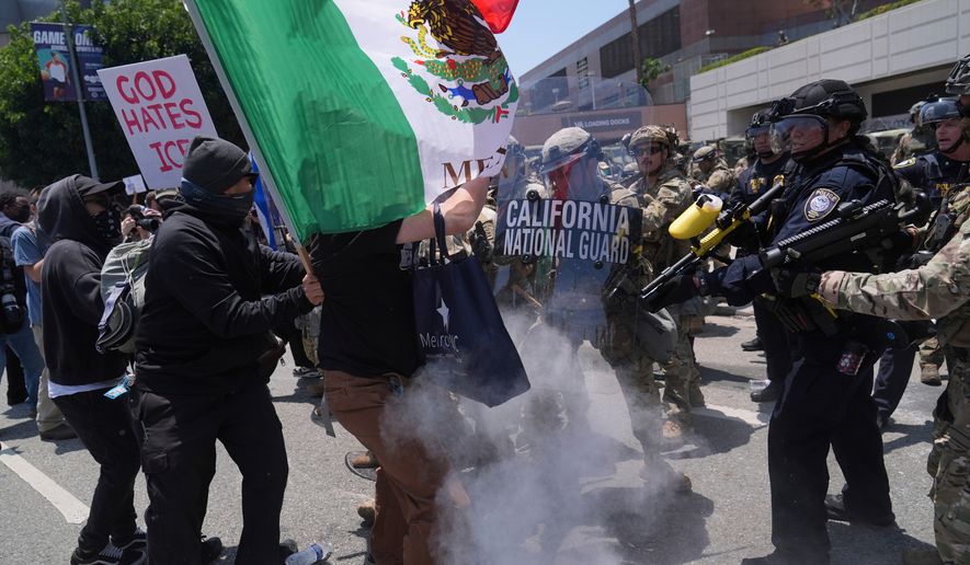 Protesters clash with authorities in downtown Los Angeles, June 8, 2025, following the night's immigration raid protest. (AP Photo/Jae Hong, File)