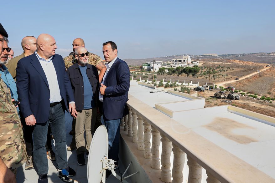 In this photo released by the Lebanese Presidency press office, Lebanese President Joseph Aoun, left, visits near the site where Israel captured a strategic hill earlier this month, in Zawtar al-Gharbieh, southern Lebanon, Saturday, Sept. 12, 2026. (Lebanese Presidency Press Office via AP)