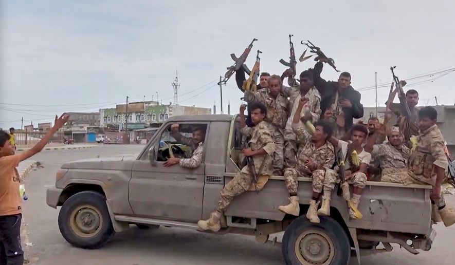 This image taken from undated video released by Al-Masirah TV, a channel owned by Yemen's Houthi rebels, on Friday, Sept. 11, 2026, shows, according to the channel, Houthi fighters chanting atop a pickup truck in Khawkhah, Hodeida province, Yemen. (Al-Masirah TV via AP)