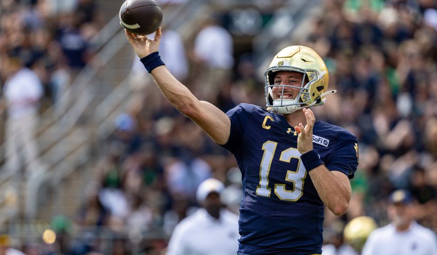 Notre Dame quarterback CJ Carr (13) throws before an NCAA college football game against Rice, Saturday, Sept. 12, 2026, in South Bend, Ind. (AP Photo/Paul Barnick)
