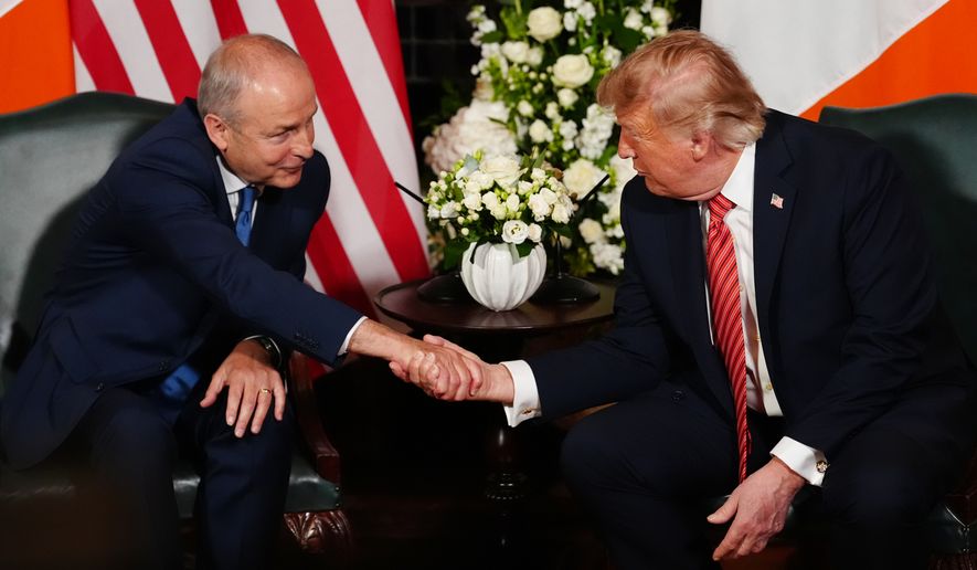 Ireland's Prime Minister Micheál Martin, left, shakes hands with U.S. President Donald Trump during a meeting at Farmleigh House in Dublin, Saturday, Sept. 12, 2026. (AP Photo/Julia Demaree Nikhinson)