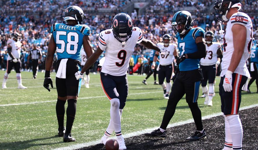 Chicago Bears wide receiver Jahdae Walker (9) celebrates after scoring a touchdown during the second half of an NFL football game, Sunday, Sept. 13, 2026, in Charlotte, N.C. (AP Photo/Scott Kinser)