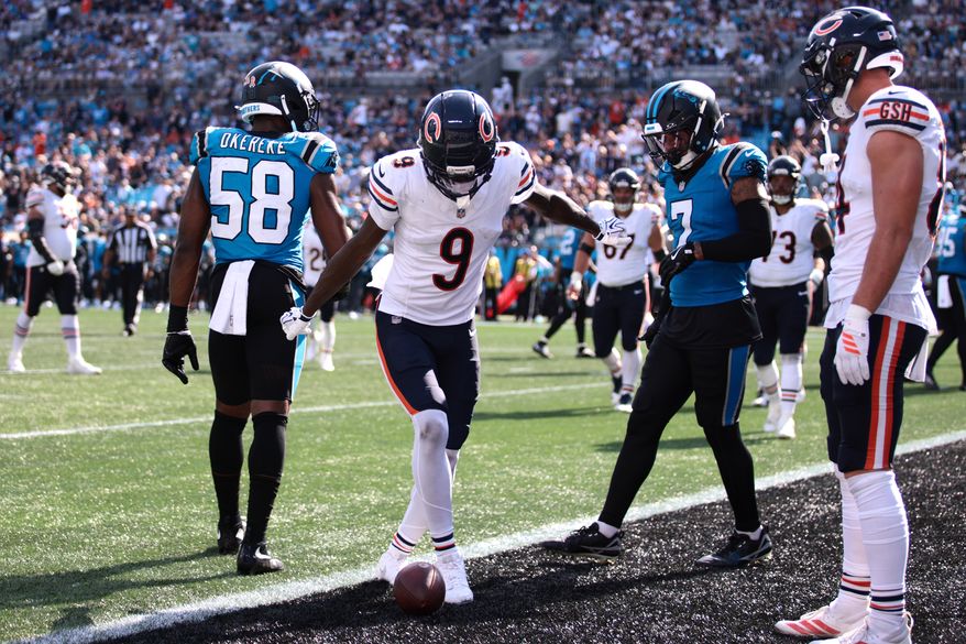 Chicago Bears wide receiver Jahdae Walker (9) celebrates after scoring a touchdown during the second half of an NFL football game, Sunday, Sept. 13, 2026, in Charlotte, N.C. (AP Photo/Scott Kinser)