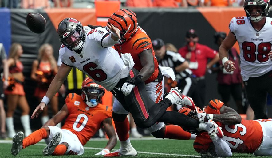 Tampa Bay Buccaneers quarterback Baker Mayfield (6) fumbles as he is hit in the first half of an NFL football game against the Cincinnati Bengals Sunday, Sept. 13, 2026, in Cincinnati. (AP Photo/Joshua A. Bickel)