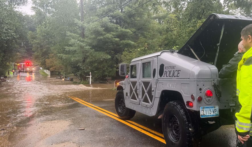 This photo provided by Westport Fire Department shows rescuers responding to flash flooding in Westport, Conn., Sunday, Sept. 13, 2026. (Jennifer Petrosinelli/Westport Fire Department via AP)