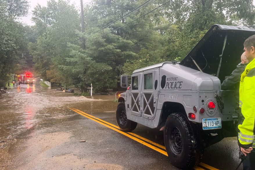 This photo provided by Westport Fire Department shows rescuers responding to flash flooding in Westport, Conn., Sunday, Sept. 13, 2026. (Jennifer Petrosinelli/Westport Fire Department via AP)