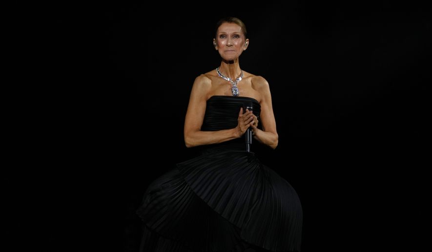 Singer Celine Dion performs during the opening concert of her "Celine Dion Paris 2026" residency at the Plenitude Arena in Nanterre, France, outside Paris, Saturday, Sept. 12, 2026. (AP Photo/Aurelien Morissard)