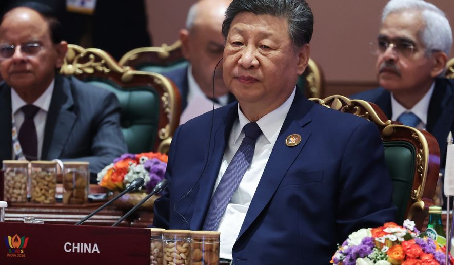 Chinese President Xi Jinping attends a session of the BRICS Plus Outreach format in New Delhi, India, on Sunday, Sept. 13, 2026. (Alexander Kazakov, Sputnik, Kremlin Pool Photo via AP)