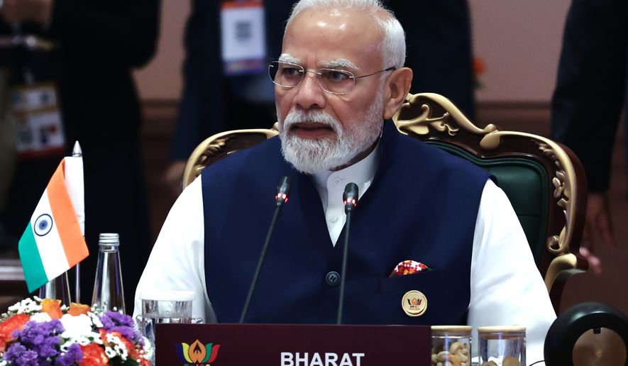 Indian Prime Minister Narendra Modi attends a session of the BRICS Plus Outreach format in New Delhi, India, on Sunday, Sept. 13, 2026. (Alexander Kazakov, Sputnik, Kremlin Pool Photo via AP)