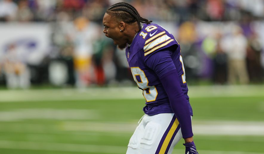 Minnesota Vikings wide receiver Justin Jefferson celebrates a defensive stop against the Green Bay Packers as he watches from the sideline during the second half of an NFL football game, Sunday, Sept. 13, 2026, in Minneapolis, Minn. (AP Photo/Bailey Hillesheim)