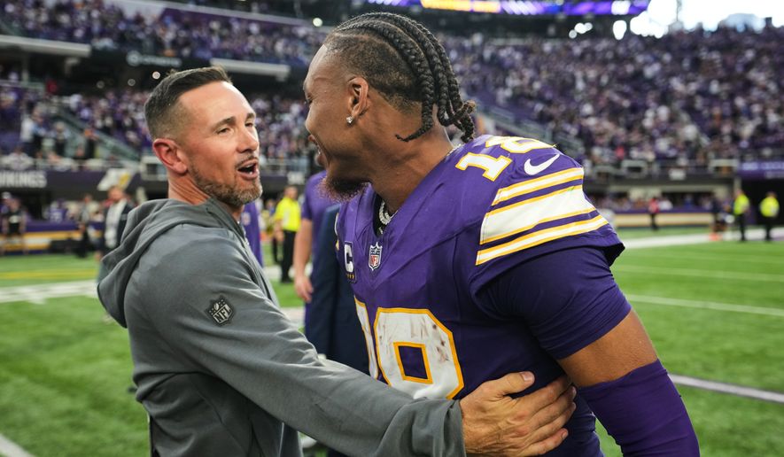 Green Bay Packers head coach Matt LaFleur, left, and Minnesota Vikings wide receiver Justin Jefferson (18) greet each other after an NFL football game, Sunday, Sept. 13, 2026, in Minneapolis, Minn. (AP Photo/Abbie Parr)
