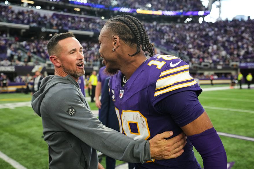 Green Bay Packers head coach Matt LaFleur, left, and Minnesota Vikings wide receiver Justin Jefferson (18) greet each other after an NFL football game, Sunday, Sept. 13, 2026, in Minneapolis, Minn. (AP Photo/Abbie Parr)