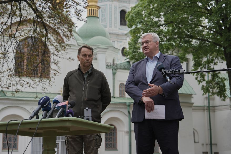 Ukrainian Foreign Minister Andrii Sybiha, right, speaks during a joint news conference with Poland's Foreign Minister Radoslaw Sikorski in Kyiv, Ukraine, Sunday, Sept. 13, 2026. (AP Photo)