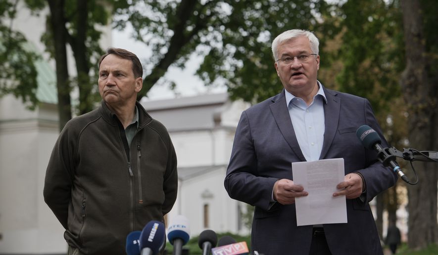 Ukrainian Foreign Minister Andrii Sybiha, right, speaks during a joint news conference with Poland's Foreign Minister Radoslaw Sikorski in Kyiv, Ukraine, Sunday, Sept. 13, 2026. (AP Photo)