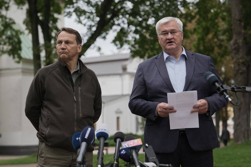 Ukrainian Foreign Minister Andrii Sybiha, right, speaks during a joint news conference with Poland's Foreign Minister Radoslaw Sikorski in Kyiv, Ukraine, Sunday, Sept. 13, 2026. (AP Photo)