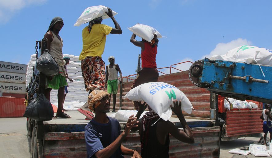 Workers load cargo at the port in Mogadishu, Somalia, Sunday, Sept. 13, 2026. (AP Photo/Farah Abdi Warsameh)