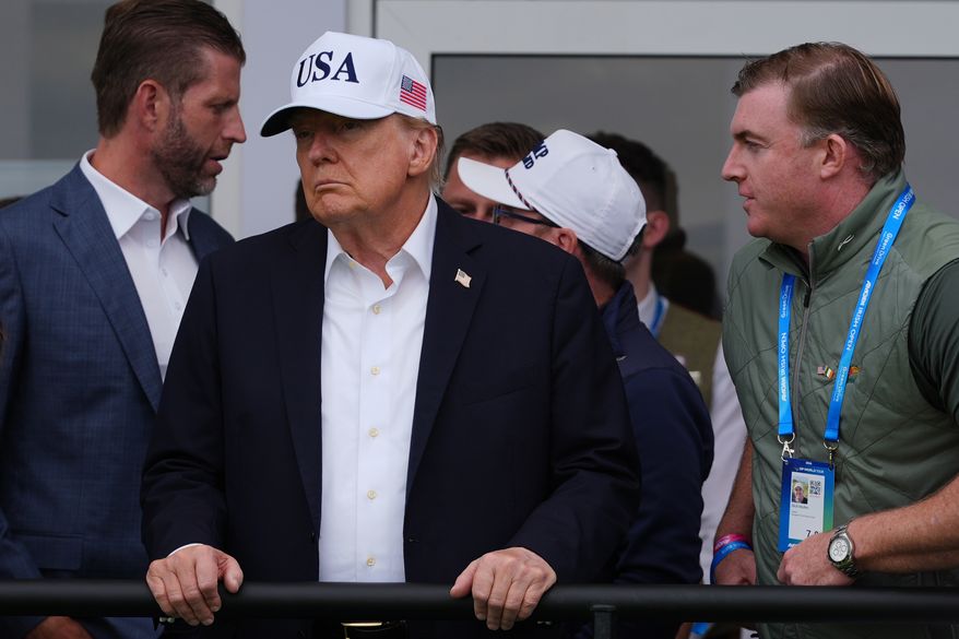 President Donald Trump watches as Shane Lowry from Ireland wins the Irish Open golf tournament at Trump International Golf Links Ireland, Sunday, Sept. 13, 2026, in Doonbeg, Ireland. (AP Photo/Julia Demaree Nikhinson)