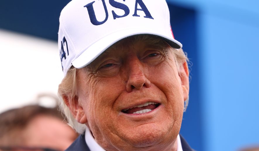 U.S. President Donald Trump arrives at the first tee during the Irish Open at the Trump International Golf Links course in Doonbeg, Ireland, Sunday, Sept. 13, 2026.(AP Photo/Peter Morrison)