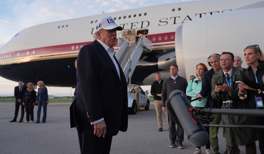 U.S. President Donald Trump speaks with journalists prior to boarding Air Force One at Shannon Airport in Shannon, Ireland, Sunday, Sept. 13, 2026. (AP Photo/Julia Demaree Nikhinson)