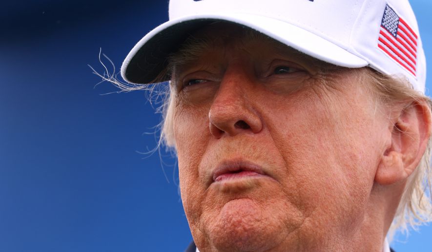 U.S. President Donald Trump attends the Irish Open at the Trump International Golf Links course in Doonbeg, Ireland, Sunday, Sept. 13, 2026.(AP Photo/Peter Morrison)
