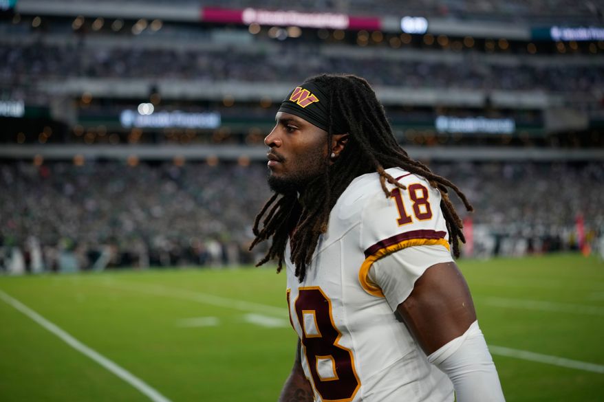 Washington Commanders safety Tyler Owens (18) leaves the field following an injury during the second half of an NFL football game against the Philadelphia Eagles, Sunday, Sept. 13, 2026, in Philadelphia. (AP Photo/Matt Slocum)