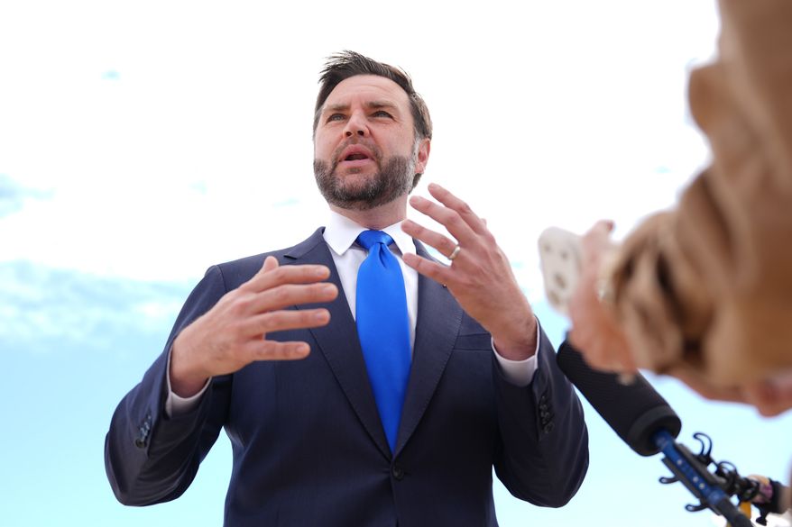 Vice President JD Vance talks to reporters before he boards Air Force Two, Monday, Sept. 14, 2026, at Joint Base Andrews, Md. (AP Photo/Mark Schiefelbein, Pool)