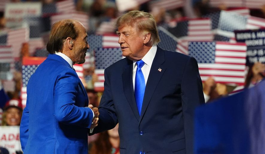 President Donald Trump greets Lee Greenwood at the Republican convention, Wednesday, Sept. 9, 2026, in Dallas. (AP Photo/Julia Demaree Nikhinson)